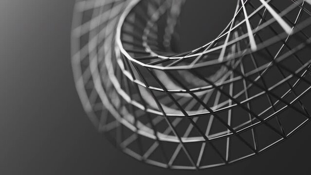 Looped 3D animation of the rotation of a geometric Mobius figure. The geometry is built from chrome plated metal cylinders. Close-up. Defocus.