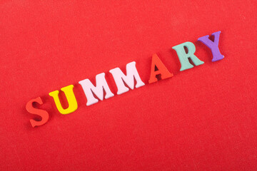 SUMMARY word on red background composed from colorful abc alphabet block wooden letters, copy space...