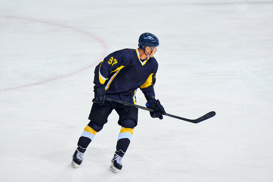 Hockey players are actively fighting for the puck
