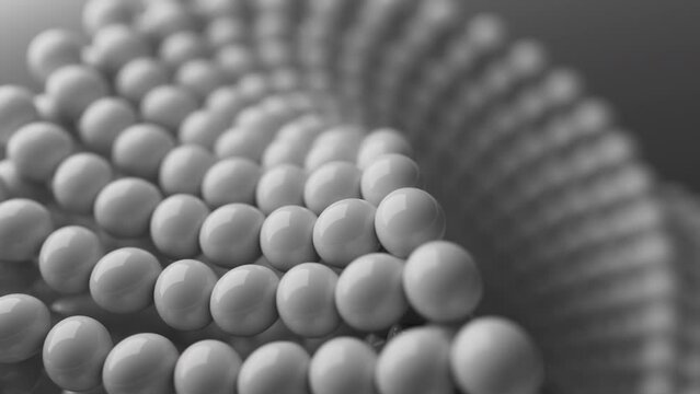 Looping 3D animation of the rotation of a Mobius geometric figure. The geometry is built from a spherical array of shapes. Close-up. Defocus.