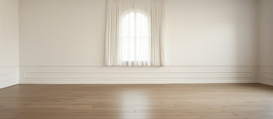 Fototapeta premium The room features white walls and a wooden parquet floor, with a window framed by white curtains. The sunlight streams in, casting soft shadows on the floor.
