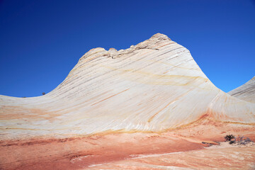Colorful sandstone formations of the White Domes in the Canaan Mountains and clear blue sky near...