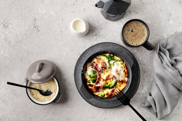 Broccoli, bacon Cheese Bake on a gray stone background