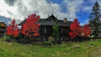 houses with beautiful architecturee and picturesque nature in autumn. szklarska poreba, karkonosze, poland