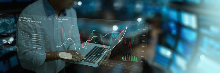 stock market analysts financial professional working with laptop computer research and analyze...