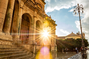 Sun shining through beautiful baroque building in Noto, Sicily, Italy