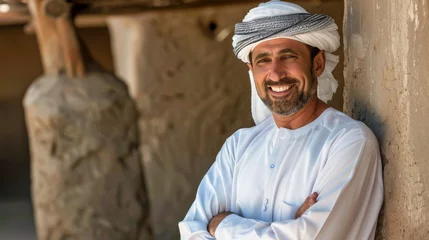 Deurstickers smiling Arabian man with arms crossed © Sasint