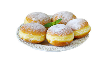 Powdered creme doughnuts stacked on a wooden dish.