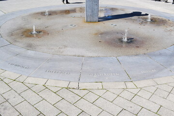 fountain with the next village names to each direction - obrazy, fototapety, plakaty