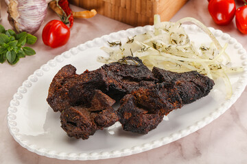 Grilled beef barbecue served onion
