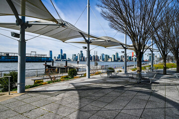 Scenic view of NBC West Street with outdoor seating under white canopies, overlooking the tranquil...