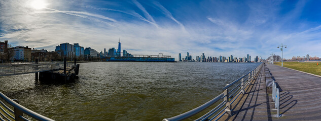 Panoramic view of Hudson River Greenway, featuring the iconic skyline and expansive water vistas...
