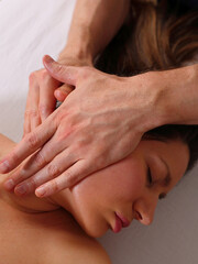 Woman enjoying Myofascial face massage. Antiaging concept. Skin and Body care. Facial beauty treatment.