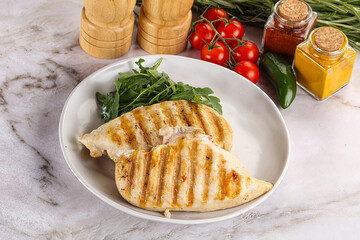 Grilled chicken breast served arugula