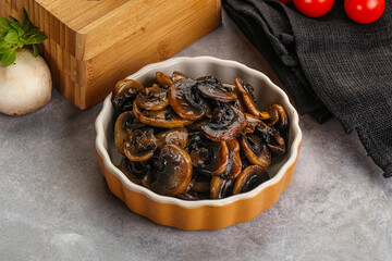 Roasted champignon mushrooms in the bowl