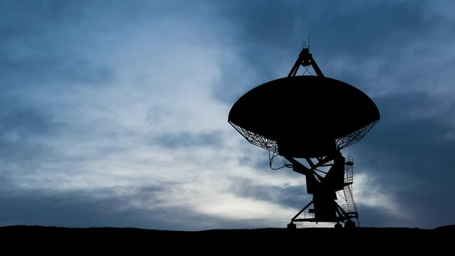 Radio telescope at dawn. Time apse