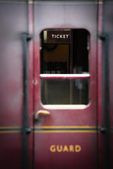 Ticket office seen through guards door on a vintage train