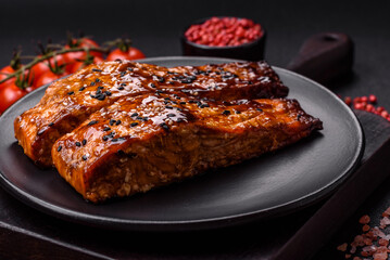 Delicious red salmon fish grilled with sauce and sesame, spices and herbs
