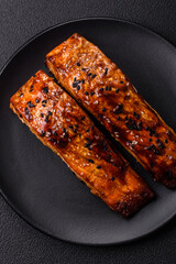 Delicious red salmon fish grilled with sauce and sesame, spices and herbs