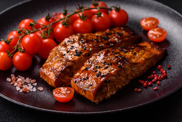 Delicious red salmon fish grilled with sauce and sesame, spices and herbs