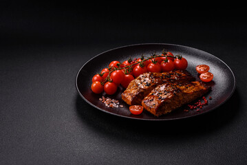 Delicious red salmon fish grilled with sauce and sesame, spices and herbs