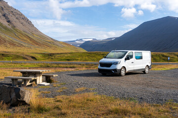 Fototapeta na wymiar Campervan parked at resting area in Westfjords, Iceland. Adventure and road trip concept