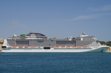 Mega modern huge cruiseship cruise ship liner Grandiosa in port of Valletta, Malta on sunny summer...
