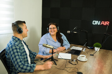 Radio talk show host talking with her guest on air