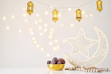 Ramadan kareem background . Ramadan moon decor with Islamic rosary beads and dates fruit