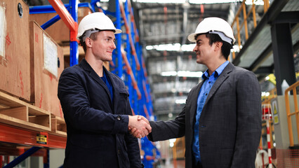 Project manager  and chief of engineer Handshake at the electrical train garage