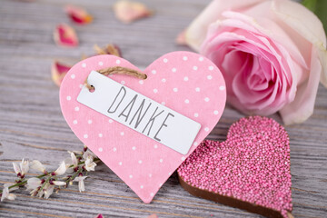 postcard pink heart with pink flowers on wooden background - 754463243