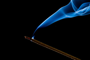 burning incense stick with smoke