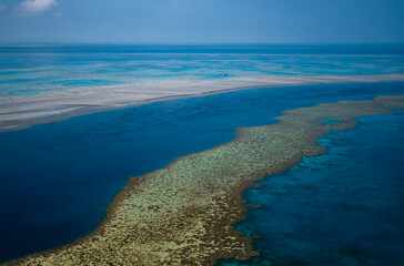Aerial view of Great Barrier Reef coral reef structure in Whitsundays, Aerilie beach, Queensland,...