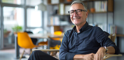 Executive team coaching, coach is a 60 year old man with graying hair and glasses sitting in a modern office. positive thinking, supportive environment