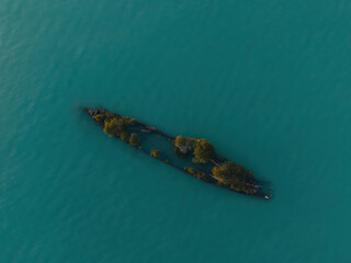 Drone Aerial Image of the S.S City of Adelaide shipwreck on Cockle Bay Magnetic Island in Townsville, Queensland, Australia. Beautiful ocean colors during sunset.
