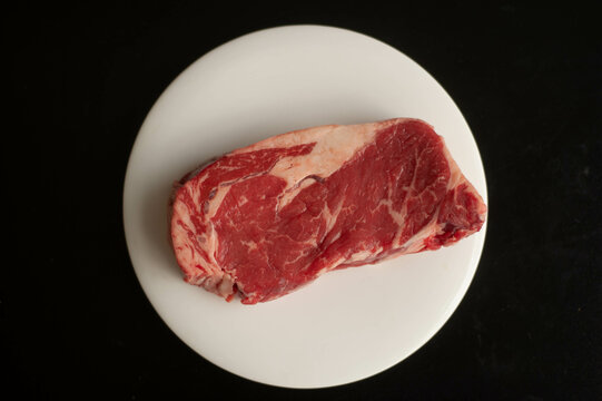raw steak on a plate