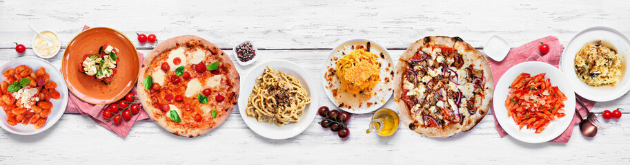 Delicious Italian food table scene. Assorted pizzas, pastas, gnocchi, risotto and bruschetta. Top view on a white wood banner background. - 754469213