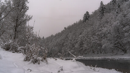 A snowy view of the P{oprad Landscape Park in Beskid Sadecki on the Poprad River.