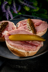 Tasty sandwich with brawn and pickled cucumber.