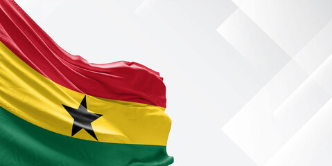 Ghana national flag cloth fabric waving on beautiful white Background.