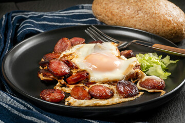 Fried egg and sliced sausage.