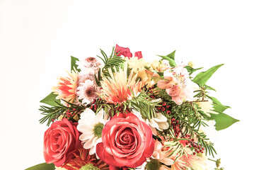 Bouquet of red roses and various flowers on a white background; Happy mother's or birthday concept