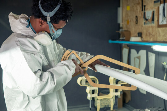 Shaper working on surf board