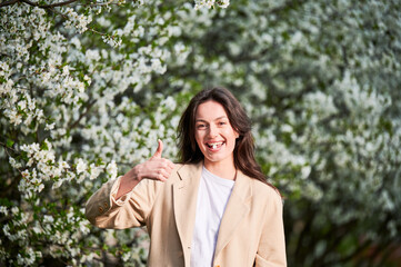 Woman allergic suffering from seasonal allergy at spring. Young happy woman applying allergy pill,...