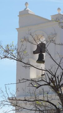 Bell tower whitewashed hermitage of a typical Andalusian. 4K Vertical