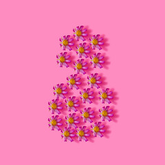 Spring creative concept. Pink flowers on pink background. Creative color background, top view