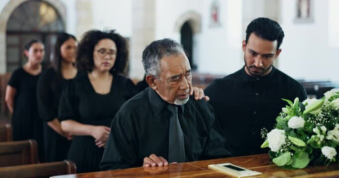 Funeral, coffin and sad man at church, mourning and console for grief with support at ceremony together. Memorial service, casket and senior person at chapel for death, goodbye or comfort for loss