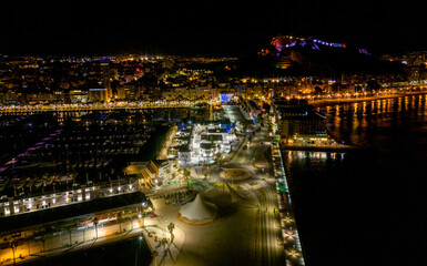 Fototapeta na wymiar Alicante by night view from drone above marine, Spain