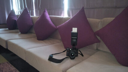 A camera on a sofa in a hotel room, Kandy, Sri Lanka. - obrazy, fototapety, plakaty