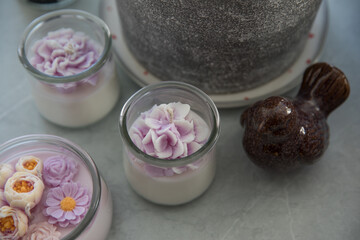 Candles in the form of colorful flowers